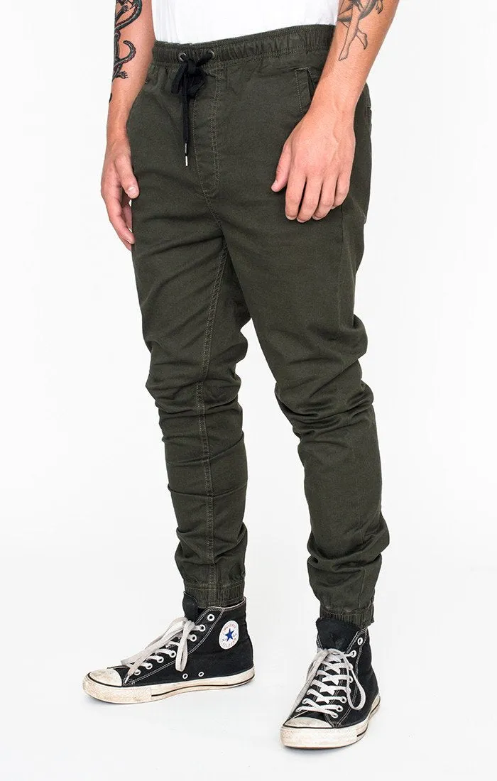 Afends Mens HAMMERPANTS - MILITARY - full elastic drill beach pant