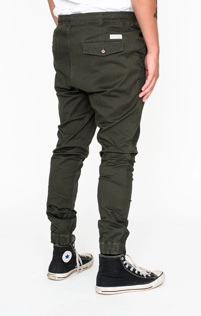 Afends Mens HAMMERPANTS - MILITARY - full elastic drill beach pant